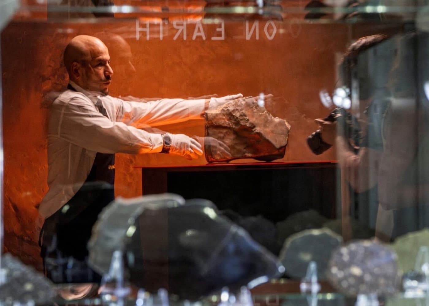 Specialist presenting a rare object representing luxury retail and special purchases