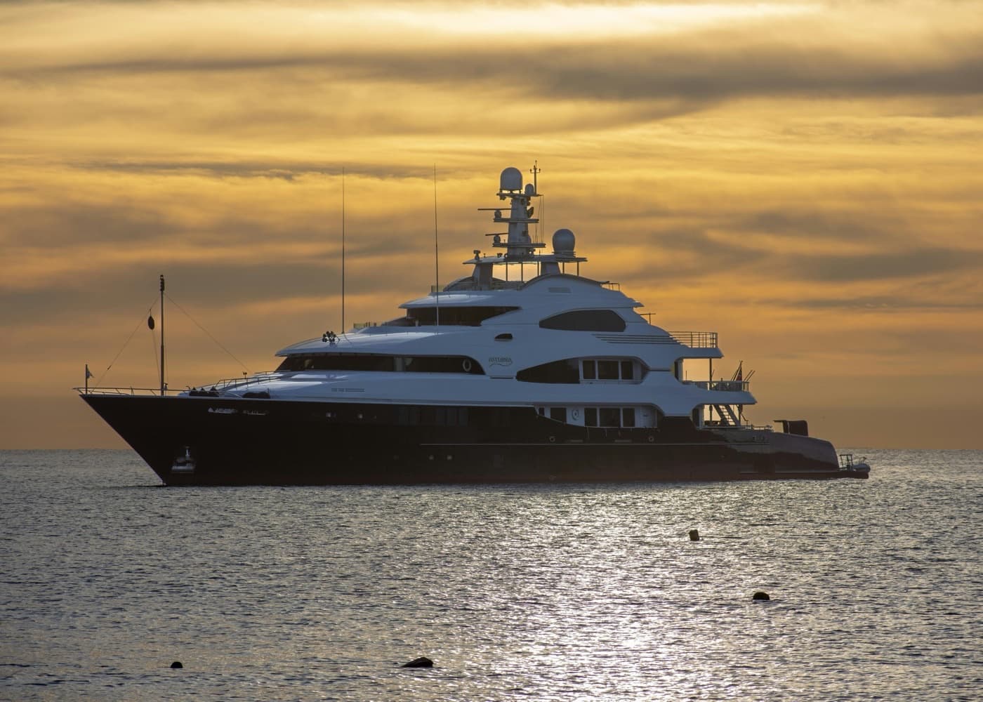 Motor yacht at sunset representing yachting and maritime support